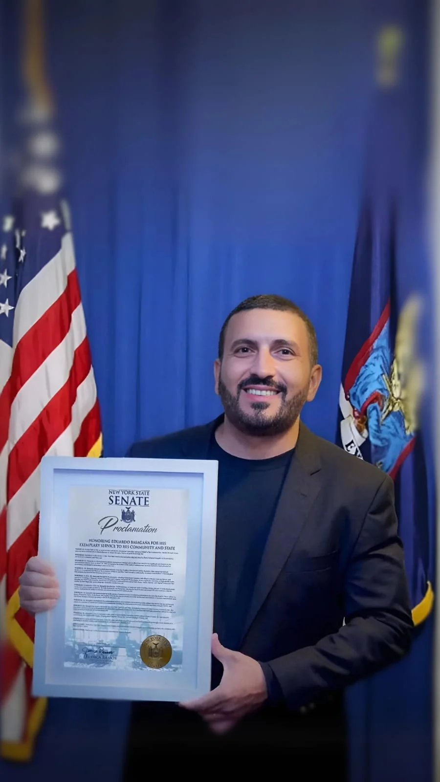 Eduardo Basagaña with the New York State Senate proclamation